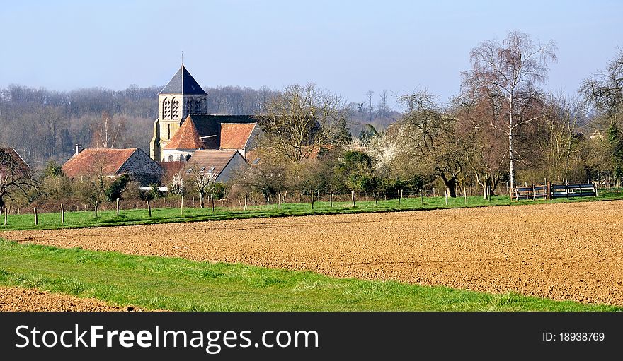 A small French village and its church in the fields. A small French village and its church in the fields