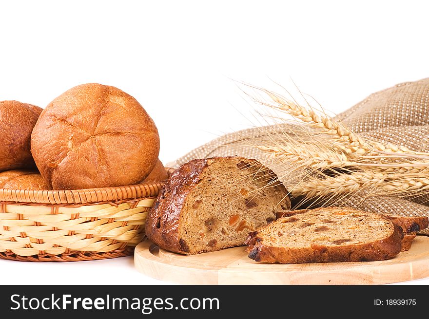 Fresh bread with ear of wheat still life