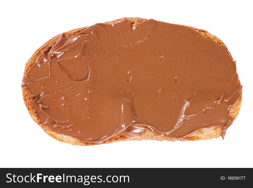 Fresh bread with chocolate paste on white