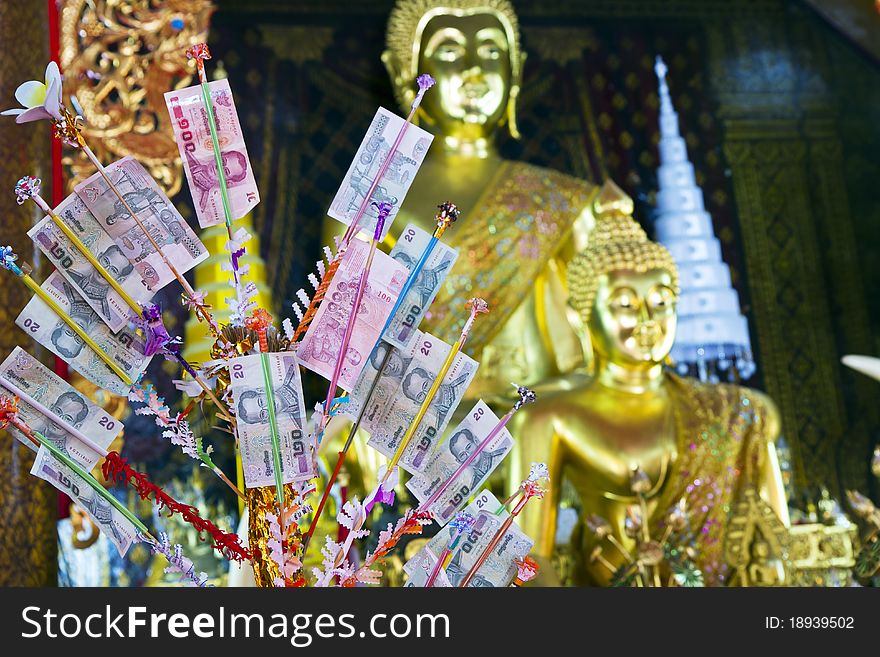 Money that people makes merit to give with Thai temple with the way takes the wood nips money ,. Money that people makes merit to give with Thai temple with the way takes the wood nips money ,