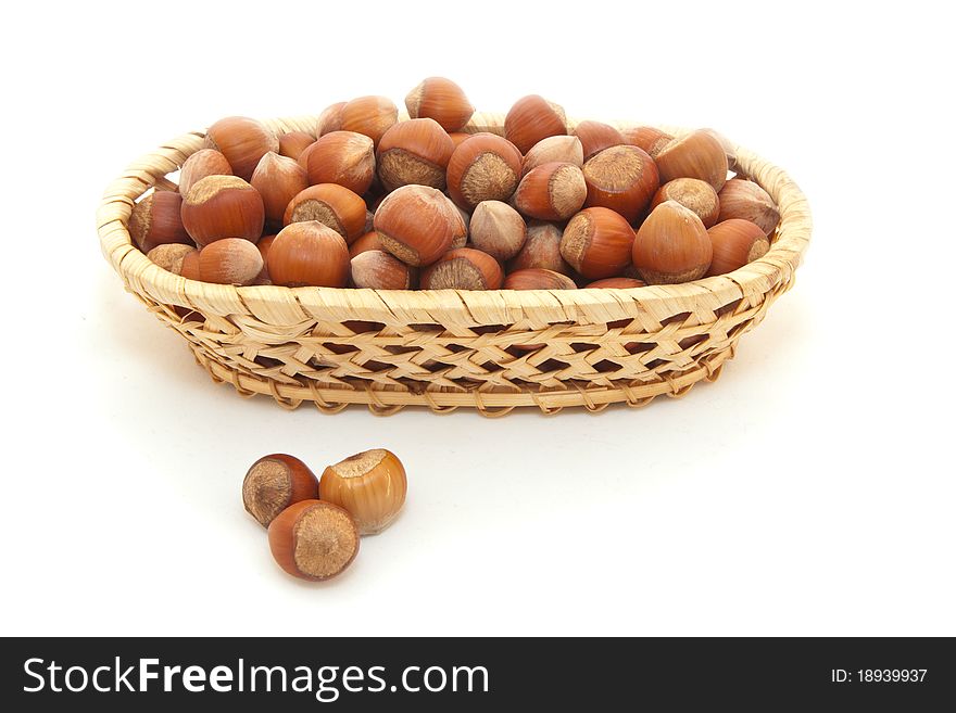 Filbert in a basket are isolated on a white background