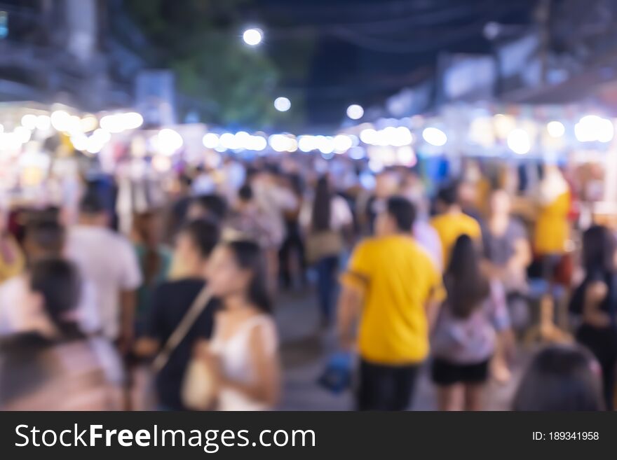 Out of focus picture of a crowd of people walking in the city