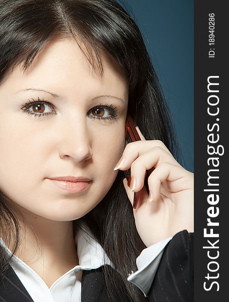 Close up of young woman talking on a mobile. Close up of young woman talking on a mobile