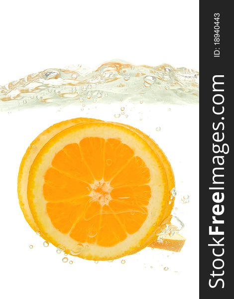 Orange thrown into the water with splash, on white background.