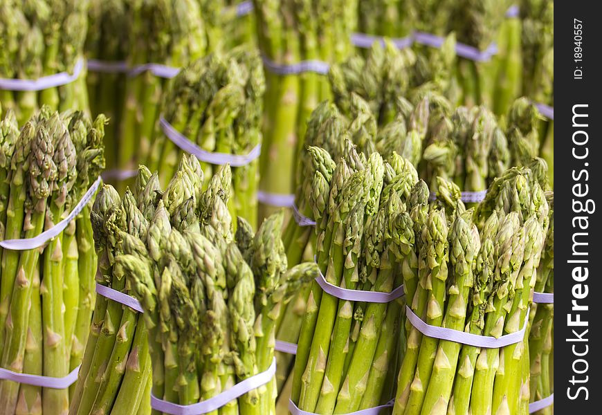 Close up on some asparagus for sale in a street market.
