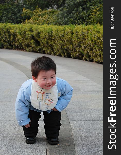 Lovely chinese boy in the garden