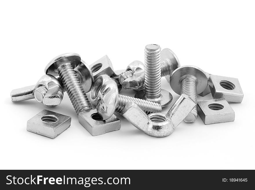 Pile of nuts and bolts over white