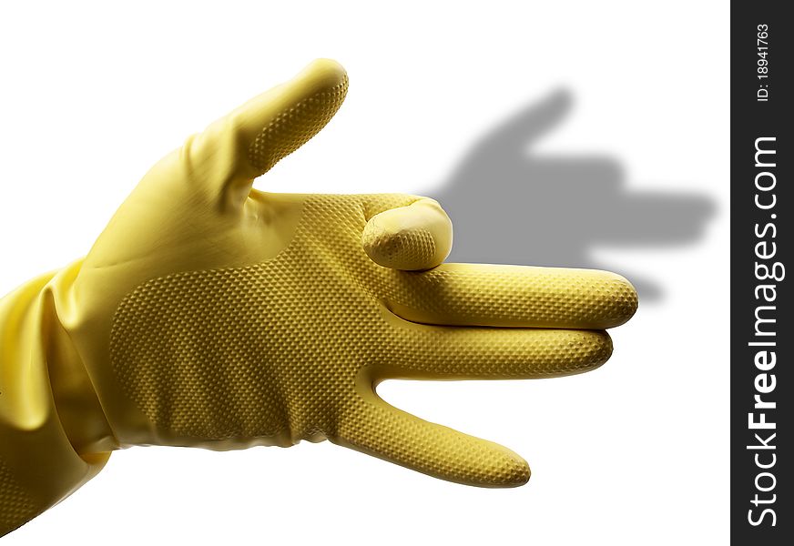 The image shows a human hand with a rubber glove over white. The image shows a human hand with a rubber glove over white