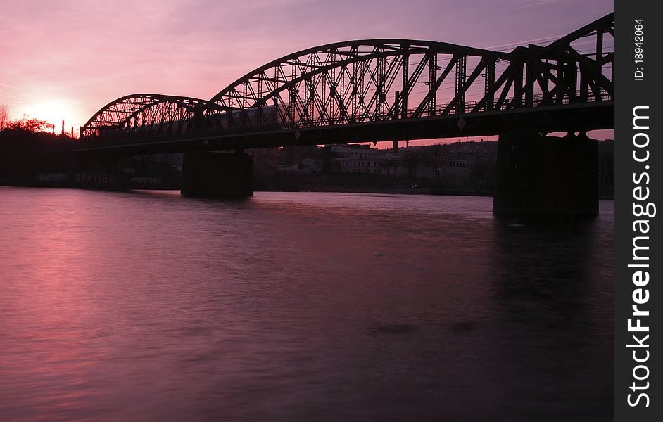 The double-track vysehrad railway bridge in Prague during the sunset. The double-track vysehrad railway bridge in Prague during the sunset.
