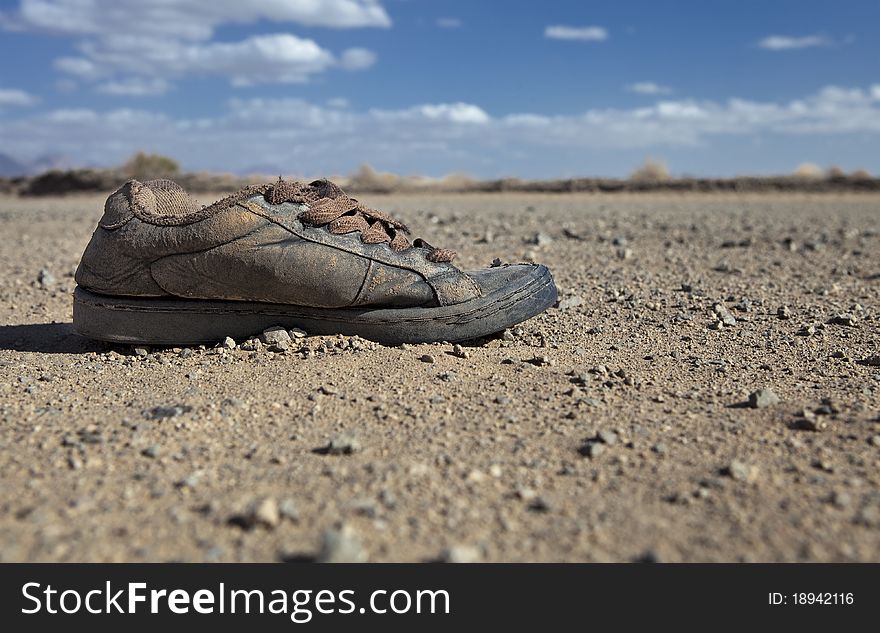 A homeless man's shoes left in the desert. A homeless man's shoes left in the desert