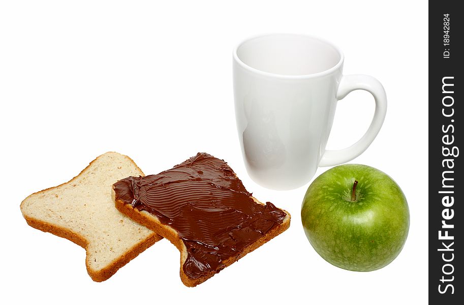 Slices of bread with chocolate cream on one of it, green apple and coffee mug isolated on a white background. Slices of bread with chocolate cream on one of it, green apple and coffee mug isolated on a white background