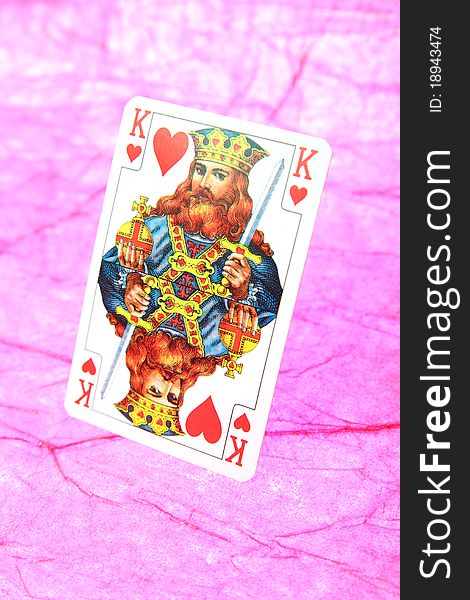 King of hearts card on purple abstract background