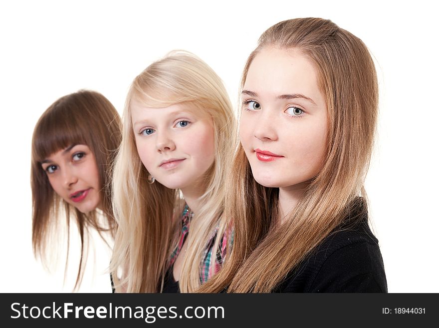 Portrait of three girls isolated on white background