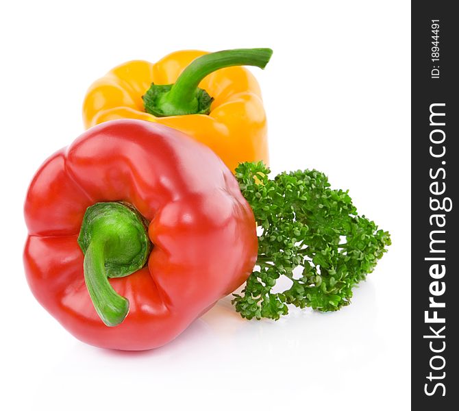 Yellow And Red Peppers decorated with greenery