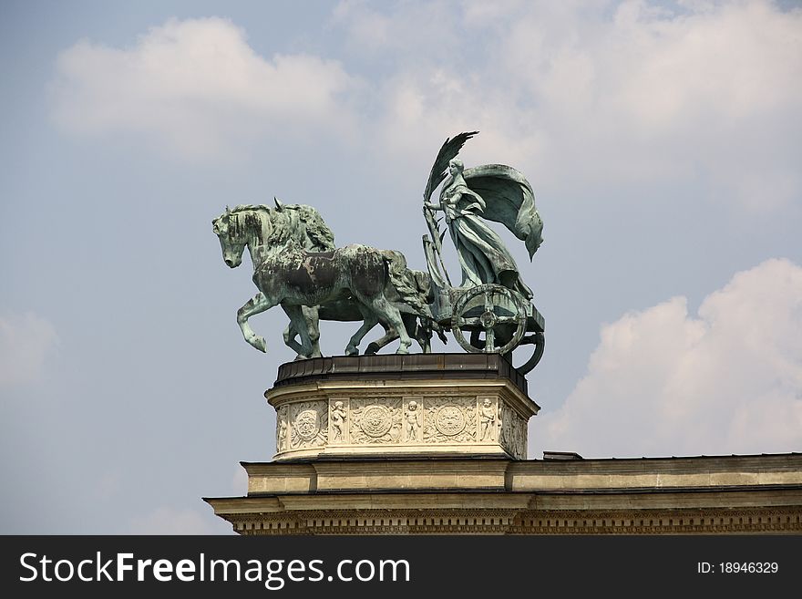 Statue atop the colonnade of the Millennium Monument in Hero Square, Budapest. Statue atop the colonnade of the Millennium Monument in Hero Square, Budapest