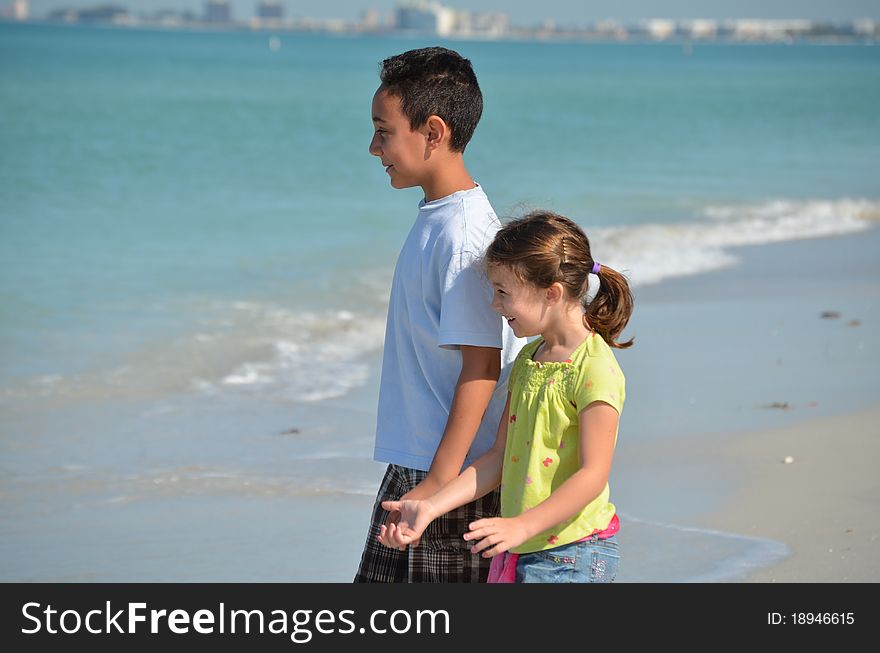 Brother and sister enjoying a day at the beach. Brother and sister enjoying a day at the beach