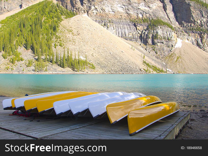 Canoes along the shore of Moraine Lake, Banff National Park, Alberta, Canada