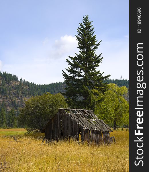 Old antique barn in a farmers field near Shuswap Lake, British Columbia,Canada. Old antique barn in a farmers field near Shuswap Lake, British Columbia,Canada