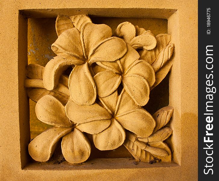 Yellow flowers made of stone. By means of carving. Yellow flowers made of stone. By means of carving