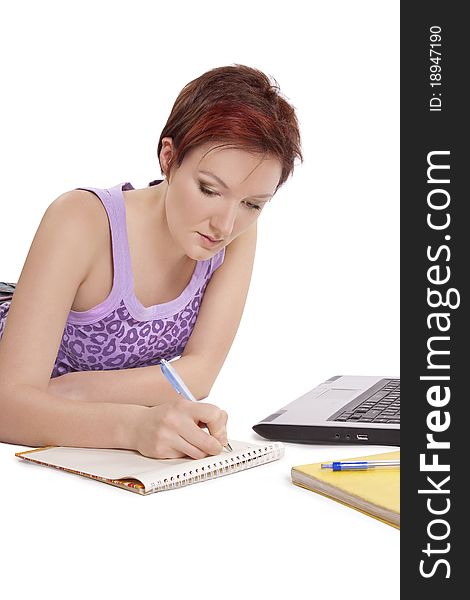 Girl doing her homework on white background.