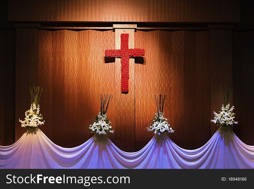 Red flower cross and curtain with white flowers. Red flower cross and curtain with white flowers