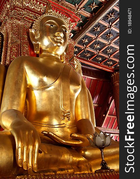 Giant golden Buddha statue in sitting position