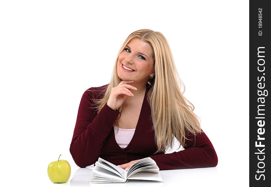 Pretty casual female with green apple reading book. isolated
