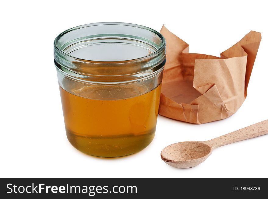 Honey In Jar With Wooden Spoon.