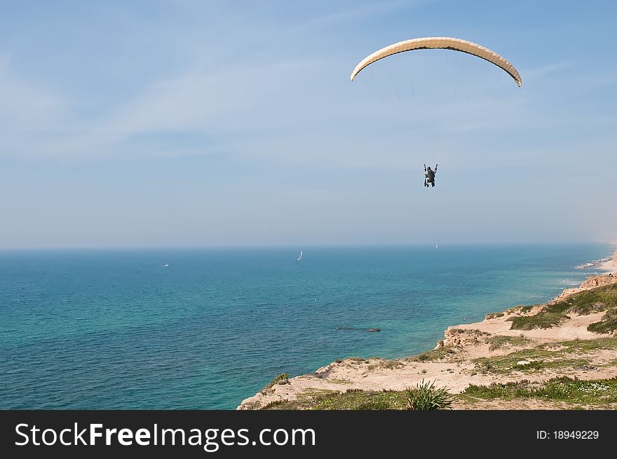 Parachute flying above the sea . Israel . Parachute flying above the sea . Israel .