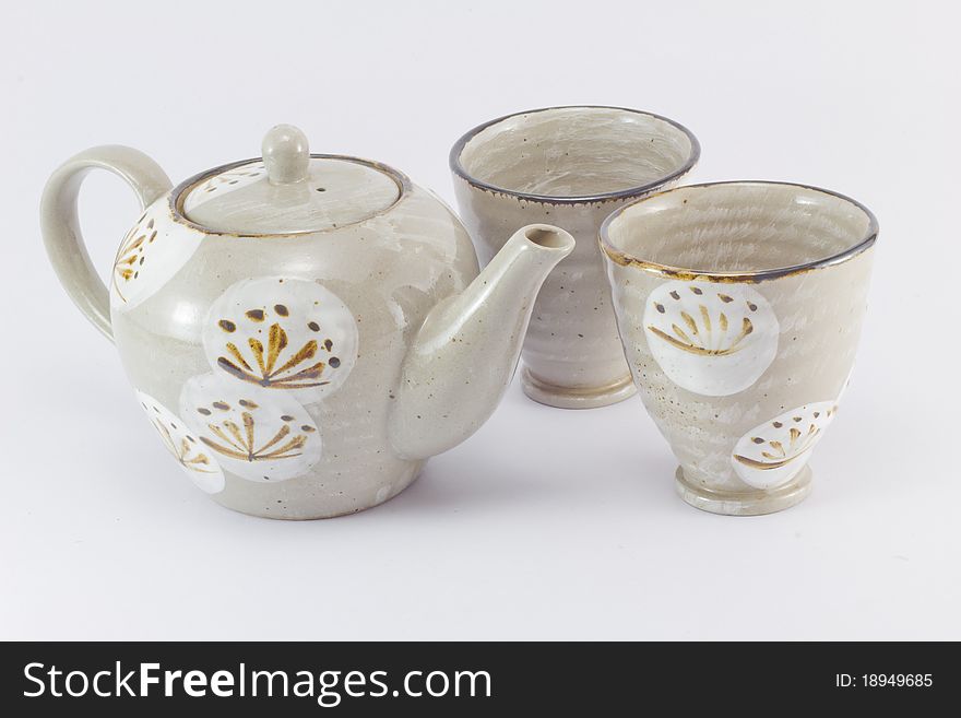 A set of teapot and teacup on white background. A set of teapot and teacup on white background