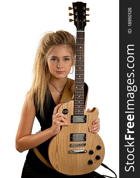 Blond rock teenage girl with an electric guitar. Studio shot, isolated on white background. Blond rock teenage girl with an electric guitar. Studio shot, isolated on white background.