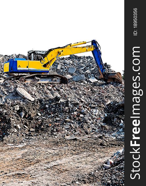 Blue with yellow excavator digging stones and dirt