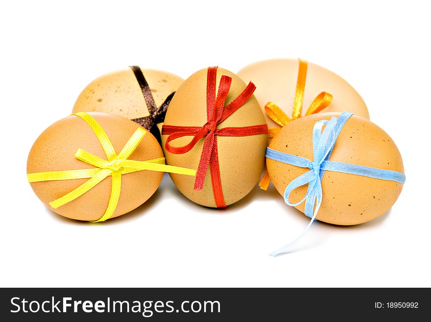 Easter eggs with different ribbons and bows, isolated on white. Easter eggs with different ribbons and bows, isolated on white