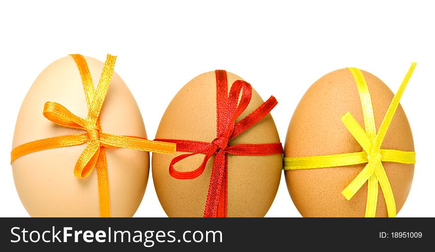 Easter eggs with different ribbons and bows, isolated on white. Easter eggs with different ribbons and bows, isolated on white