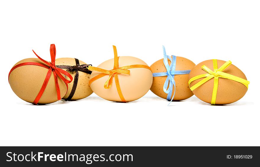 Easter eggs with different ribbons and bows, isolated on white. Easter eggs with different ribbons and bows, isolated on white