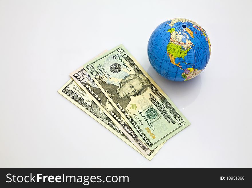 Globe and dollar depicting global currency