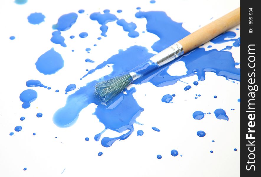 Brushes and paints on a white background