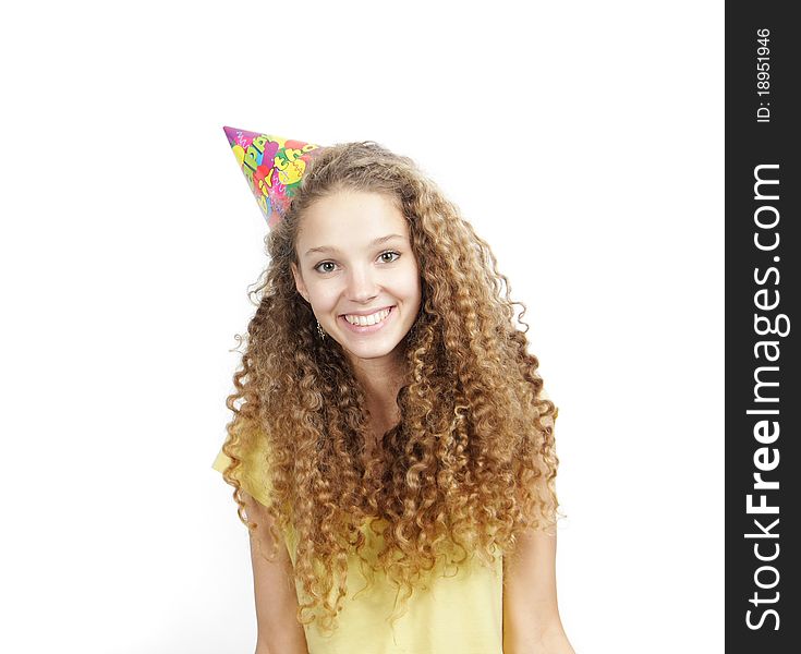 Smiling woman in birthday hat over white