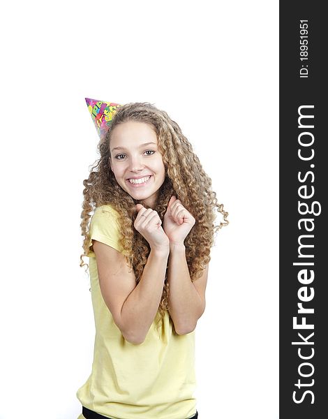 Young smiling woman in birthday hat over white