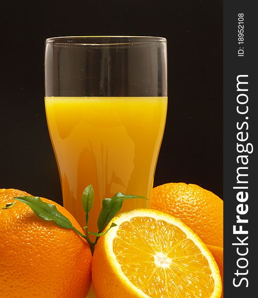 Orange juice isolated on black background