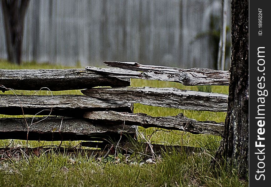 Phtograph of a split rail fence, aged wood with beautiful texture