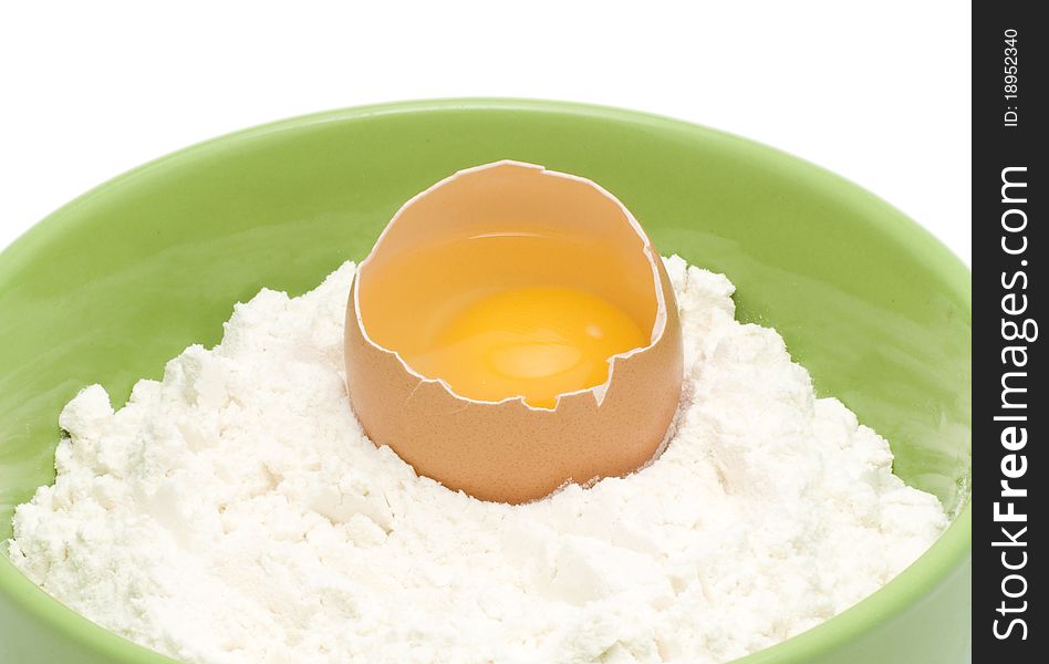 Egg picture in a flour on a white background. Egg picture in a flour on a white background