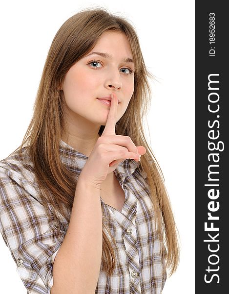 Young woman says ssshhh to maintain silence on a white background