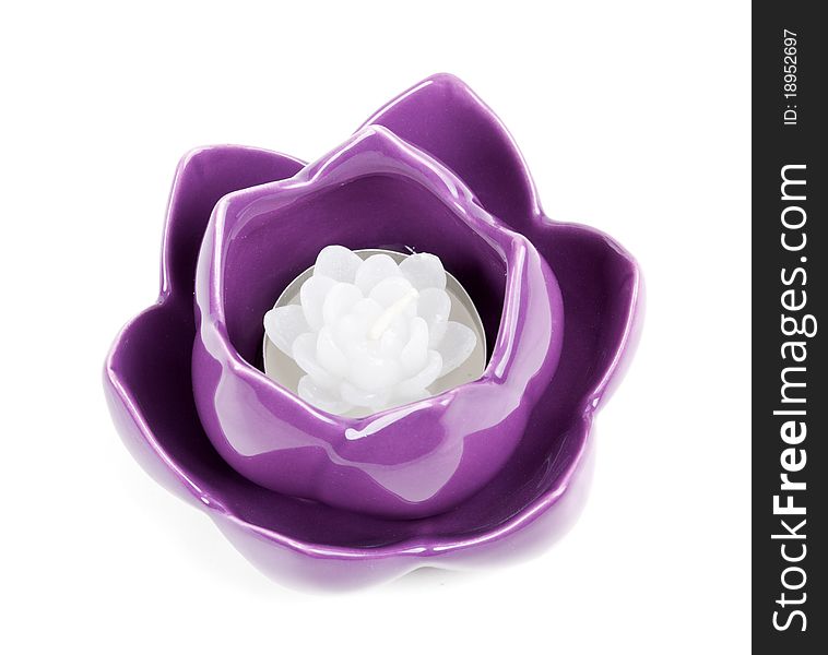 Candle in the form of porcelain violet isolated on a white background