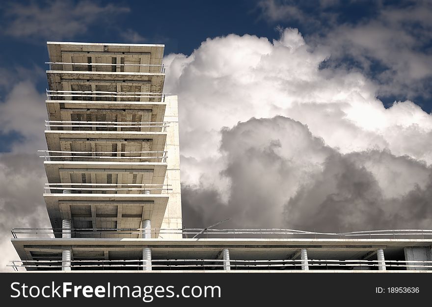 Construction site, building,  and cloudy sky