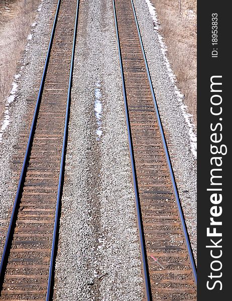 Rail tracks running towards an unknown destination