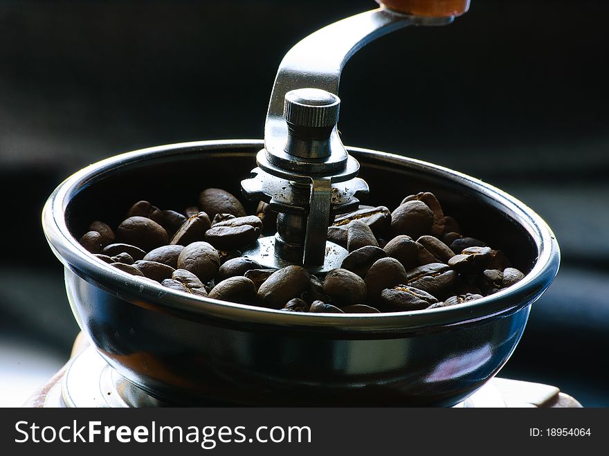 Close-up of roasted coffee beans. Full mill.