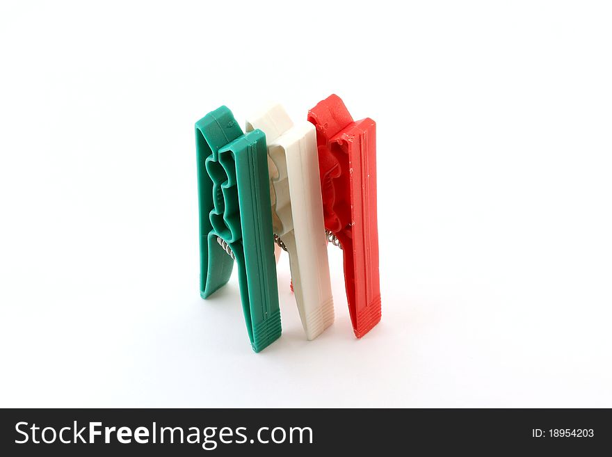 Three plastic clips, depicting the Italian flag colors. Three plastic clips, depicting the Italian flag colors