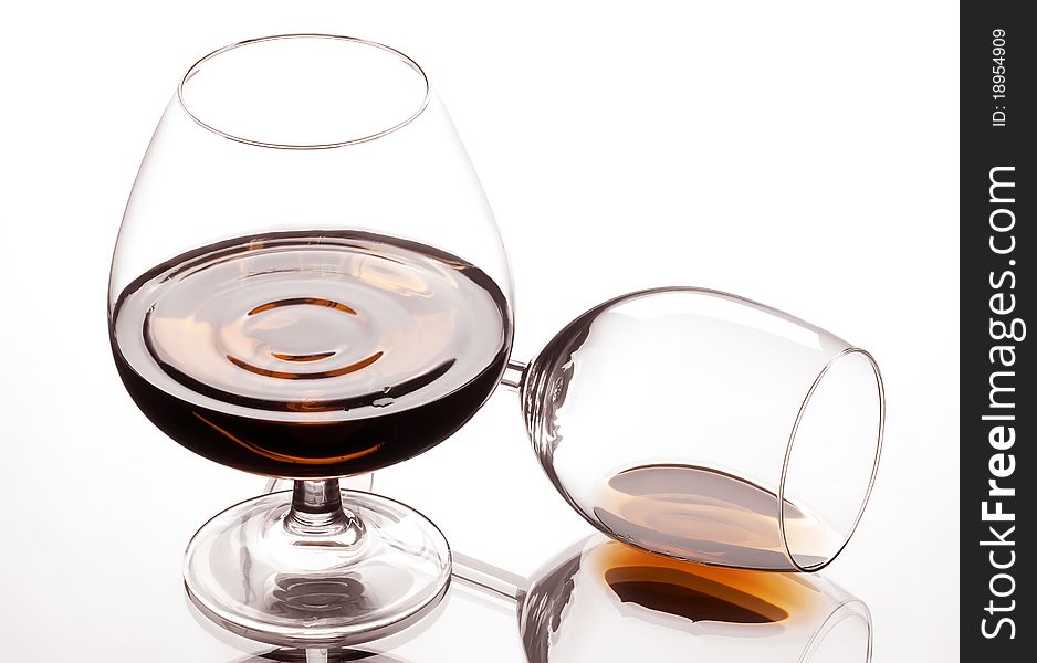 Two glass about a brandy and reflection. Two glass about a brandy and reflection