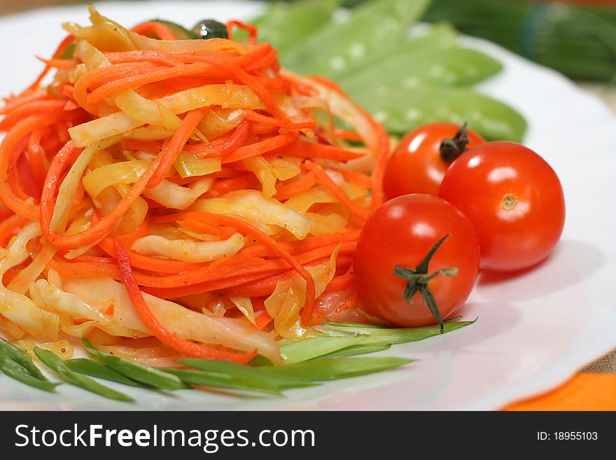Fresh Salad on plate. Carrot and bell pepper